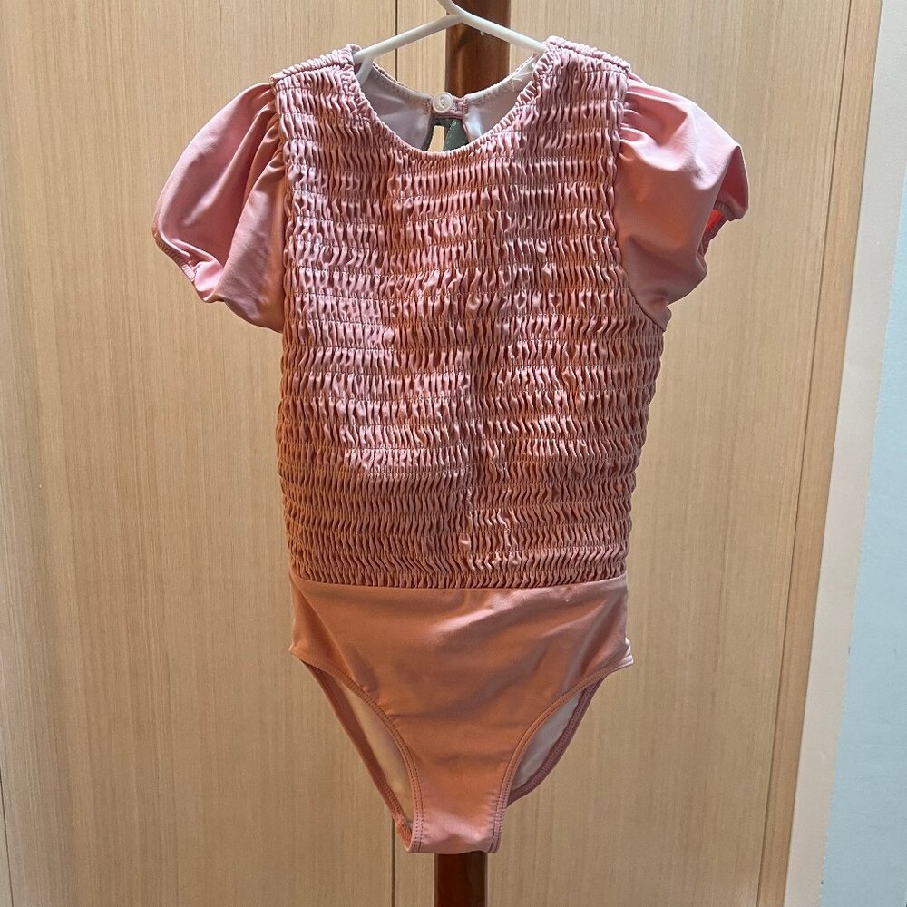 Girls sorbet pink puff sleeve smocked one piece